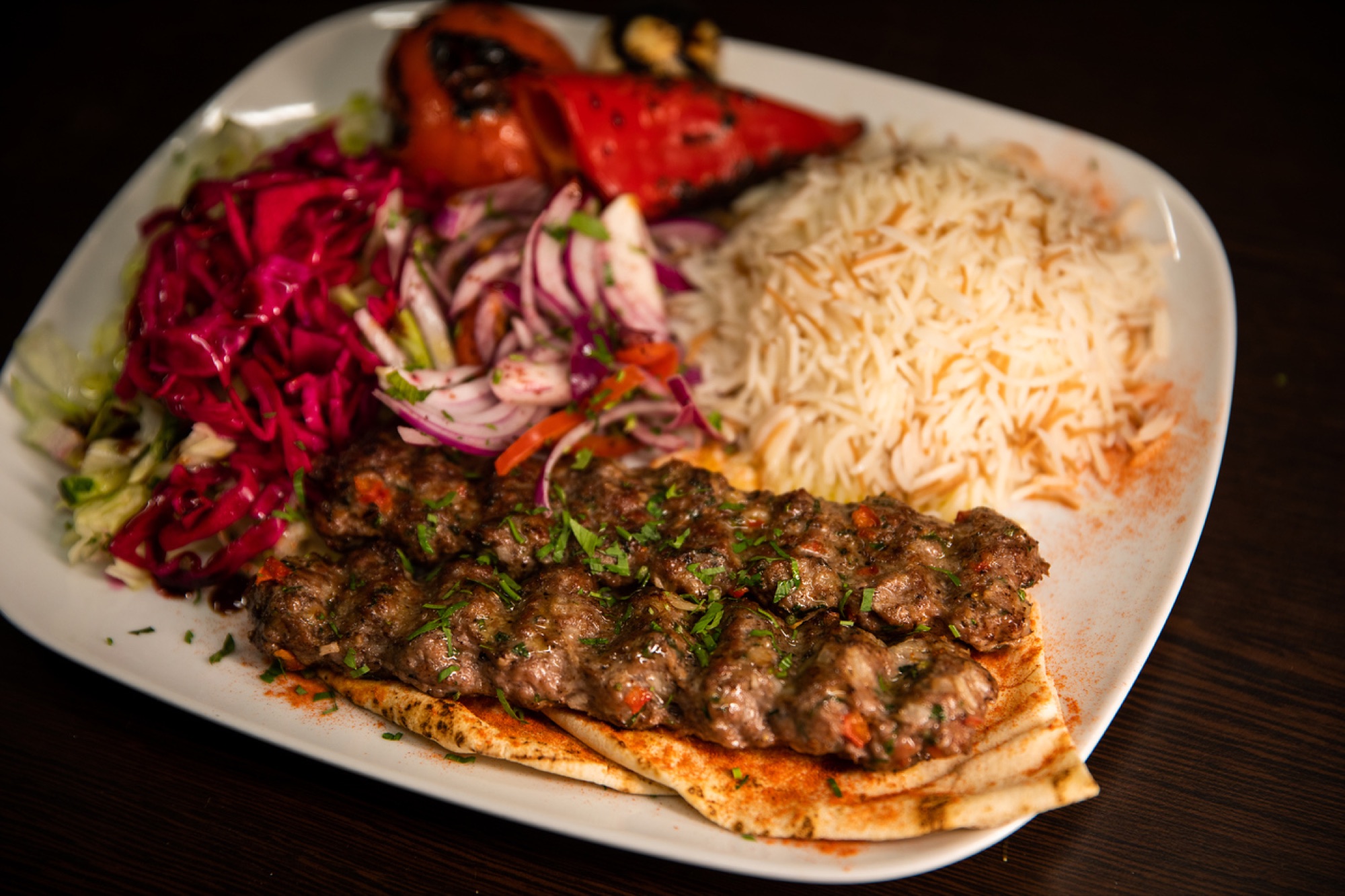 Kofta, rice, salad and grilled vegetables served at North Star